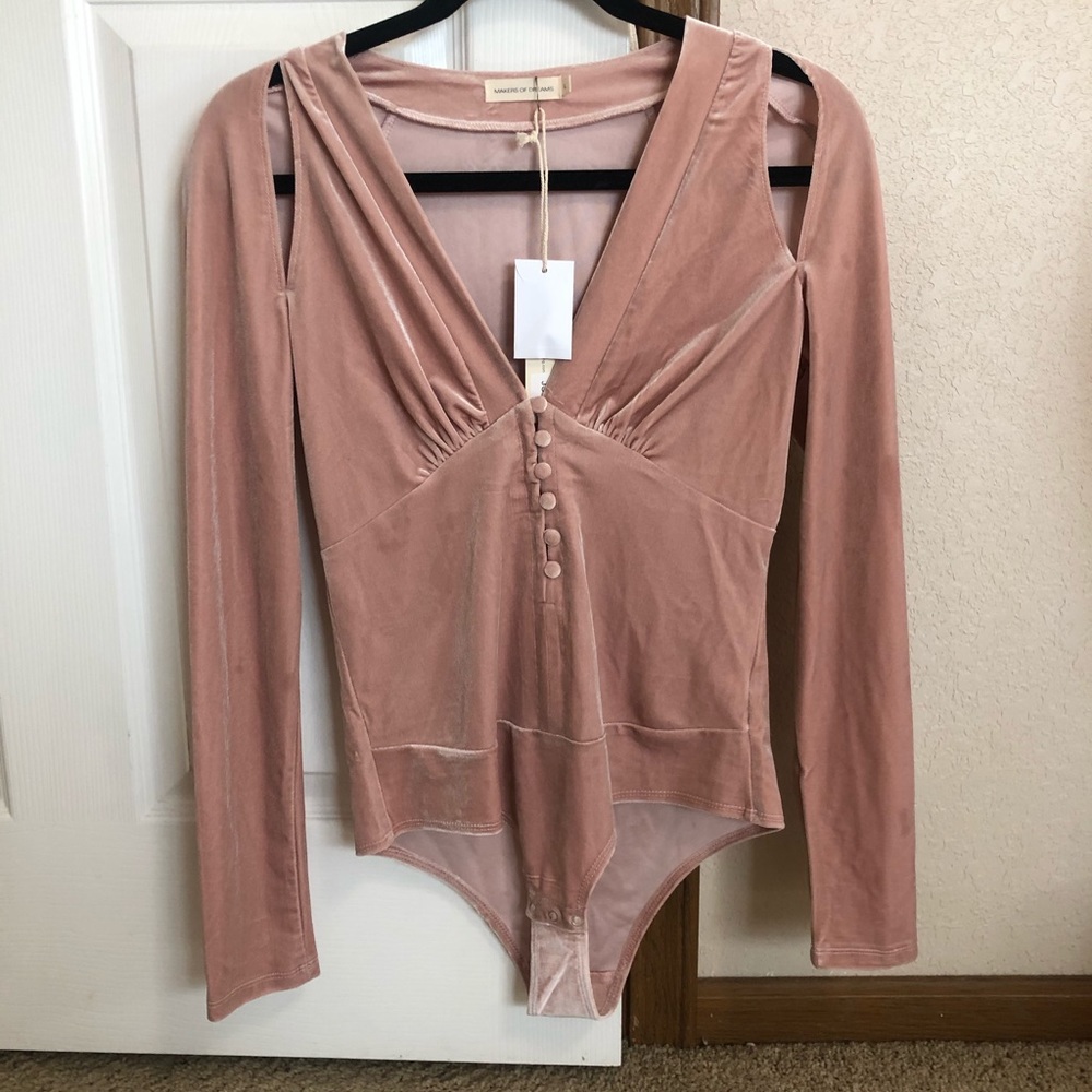 Look at her velvet bodysuit